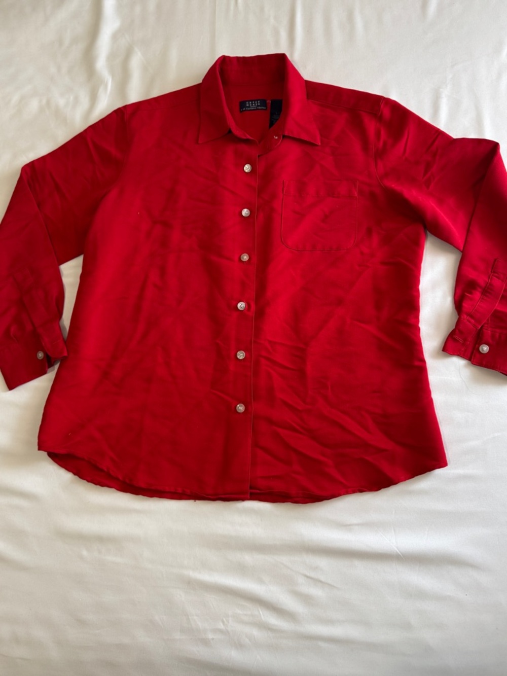 Red women’s button up shirt with a classic collar and long sleeves